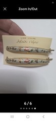 These Genuine Cloisonné Barrettes Feature A Delicate Floral Design a gold-tone