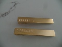 New BURBERRY a pair of logo hair clips from brass w/ gold plating & KS pure CO.
