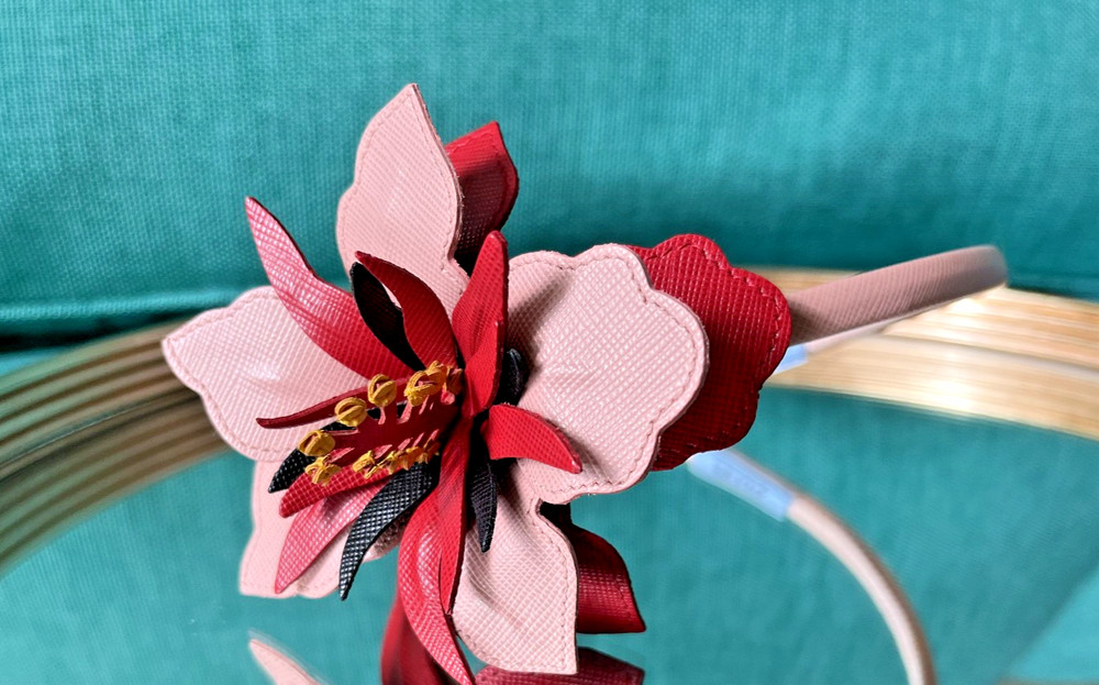 Prada saffiano leather headband with a floral embellishment