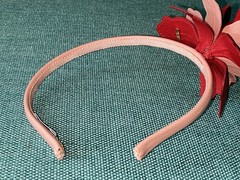 Prada saffiano leather headband with a floral embellishment
