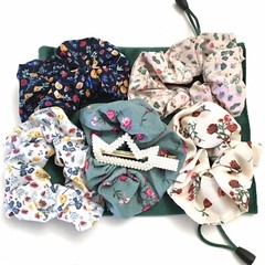 5 Silky Hair Ties and a Pearl Crown Hair Clip in a Green Velvet Drawstring Bag