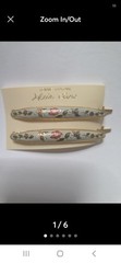 These Genuine Cloisonné Barrettes Feature A Delicate Floral Design a gold-tone