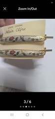 These Genuine Cloisonné Barrettes Feature A Delicate Floral Design a gold-tone