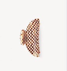 A double-walled hair claw designed to hold medium volumes of hair