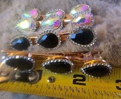 Gold Tone alligator hair clips feature teardrop-shaped rhinestones